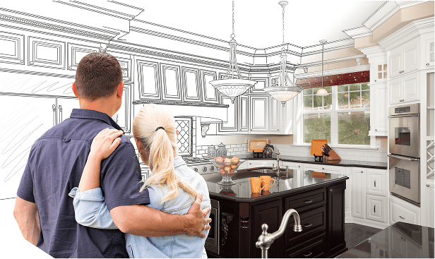 A couple is looking at the kitchen in their home.