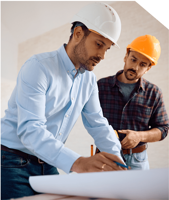 Two men in hard hats working on a project.